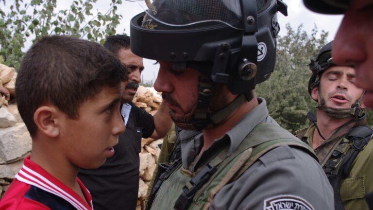 Palestinian child and border police